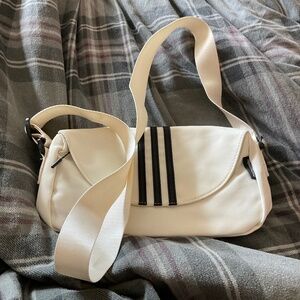 Hellomumu white crossbody purse with black stripes, never worn no tag